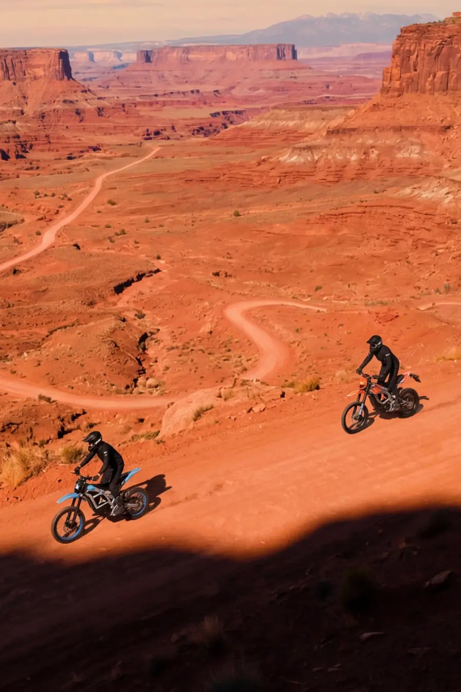 Aptum electric dirt bike riders exploring desert terrain